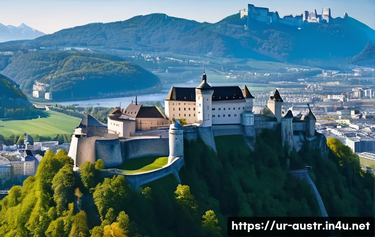오스트리아의 유네스코 문화유산 - A majestic medieval fortress perched atop a hill overlooking Salzburg city, featuring massive stone ...